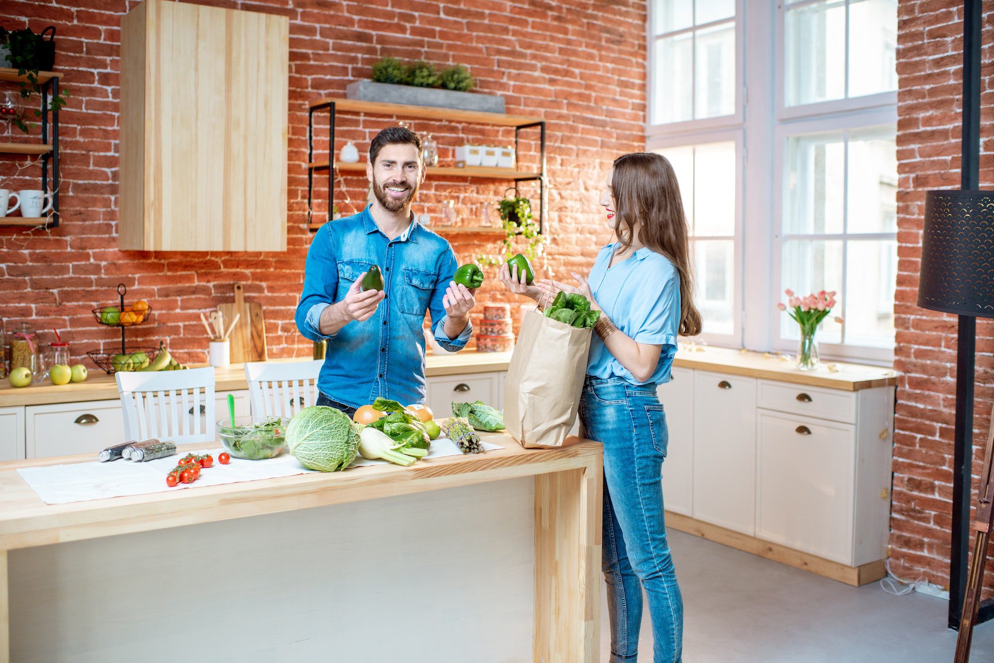 Couple with healthy food on the kitchen